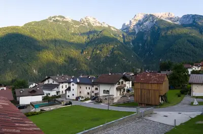 a village in the mountains with mountains in the background at Pigala Al Drit in Rivamonte