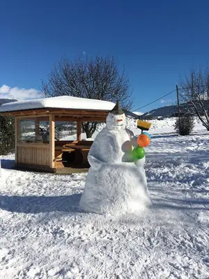 a snowman made out of balloons in front of a gazebo at Residence Untermoarhof in Brunico