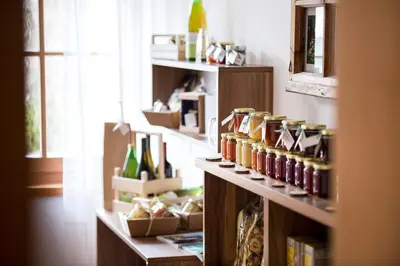 a room with shelves with bottles on them at Obereggerhof - Urlaub auf dem Bauernhof - Ferienwohnungen - Gitschberg Jochtal - Rio di Pusteria in Valles