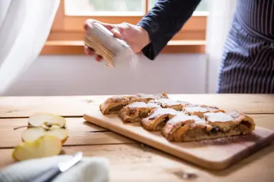 a person is washing some food on a cutting board at Obereggerhof - Urlaub auf dem Bauernhof - Ferienwohnungen - Gitschberg Jochtal - Rio di Pusteria in Valles