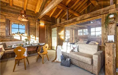 a living room with a couch and a table at Chalet Luisa in Predazzo