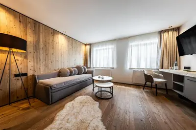 a living room with a couch and a table at Crëp Sella in Colfosco