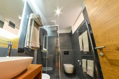 a bathroom with a glass shower and a sink at San Vigilio di Marebbe - Suite di Montagna in San Vigilio Di Marebbe