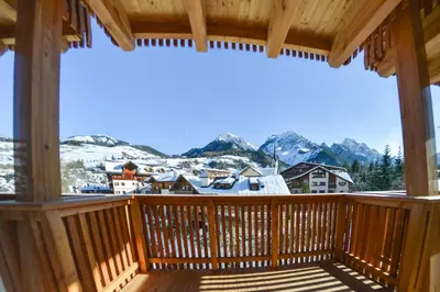 a balcony with a view of a snow covered mountain at San Vigilio di Marebbe - Suite di Montagna in San Vigilio Di Marebbe