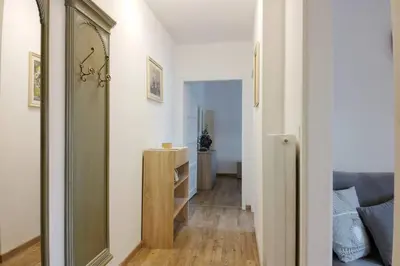 a hallway with a mirror and a couch in a room at Residence Bellavista in Fondo