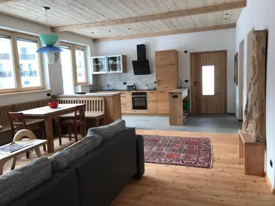 a living room with a couch and a table at Cësa Gredine in Ortisei