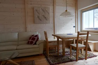 a living room with a couch and a table at Cësa Gredine in Ortisei