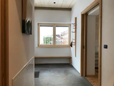 a hallway with a window and a window sill at Cësa Gredine in Ortisei