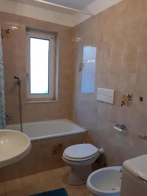 a bathroom with a toilet and a tub and a sink at Vacanzemoena - Cielo Azzurro, tipologia 1 in Moena