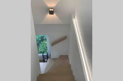 a staircase in a house with a light at Apartment Marie in Bolzano