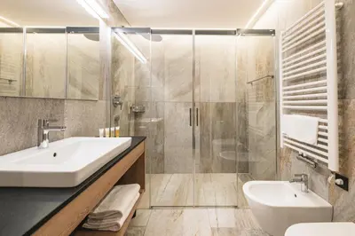 a bathroom with a sink and a shower at Residence Altea in Ortisei