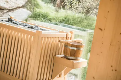 a wooden cup sitting on a wooden box on a balcony at Residence Altea in Ortisei