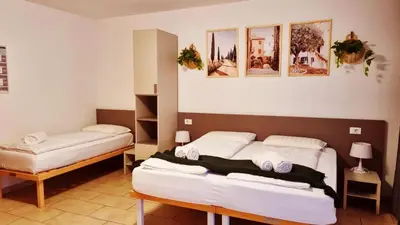 a bedroom with two beds in a room at B&B Maya in Merano