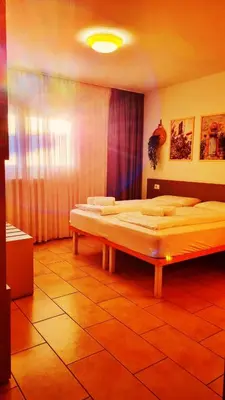 a bedroom with two beds in a room at B&B Maya in Merano