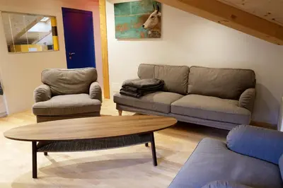 a living room with a couch and two chairs and a table at Apartment Luam - Alpstay in Naturno
