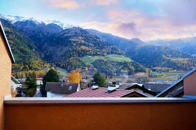 a view of a mountain range from a house at Apartment Luam - Alpstay in Naturno