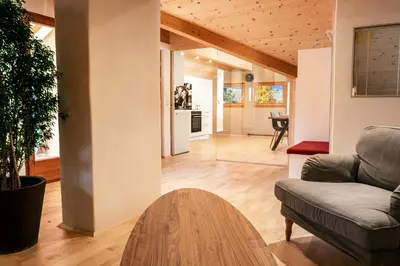 a living room with a couch and a table at Apartment Luam - Alpstay in Naturno
