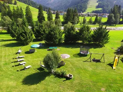 an aerial view of a park with tents and trees at Residence Colibrì in Pozza di Fassa