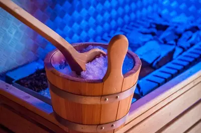 a wooden cup with a wooden spoon sitting on a table at Alpine Deluxe in Riscone