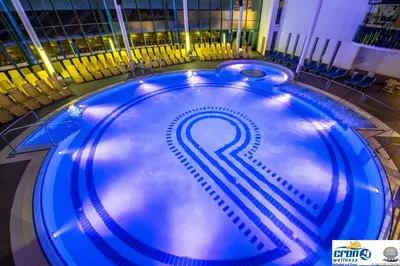 a large blue swimming pool with a question mark on it at Alpine Deluxe in Riscone