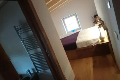 a bedroom with a bed and a window at La casa! in Vigo di Fassa