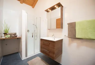 a bathroom with a sink and a shower at Schwarzhaus in Monticolo