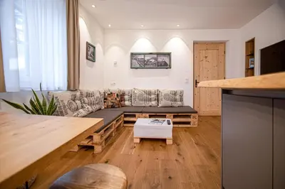 a living room with a couch and a table at haus urban in Barbiano