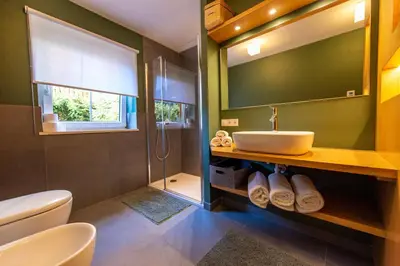 a bathroom with a sink and a mirror at Apartment Belvedere in Selva di Val Gardena