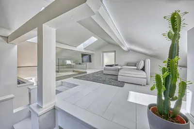 a living room with a couch and a cactus at HOMESTWENTY3 - Home two in Caldaro