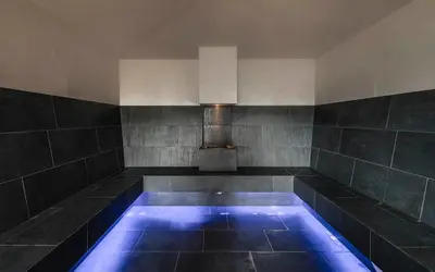 a bath tub with blue lights in a room at AEON Hotel - adults only Bed & Breakfast in Soprabolzano