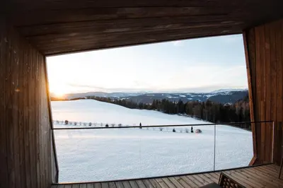 a room with a window with a view of the snow at AEON Hotel - adults only Bed & Breakfast in Soprabolzano