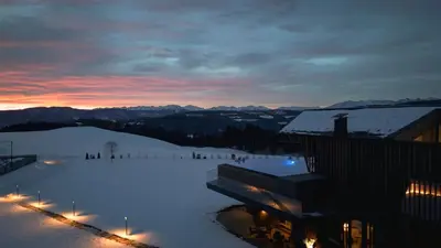 a view of a ski slope with snow and lights at AEON Hotel - adults only Bed & Breakfast in Soprabolzano