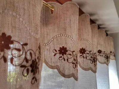a close up of curtains on a window at Casa Minela in Falcade