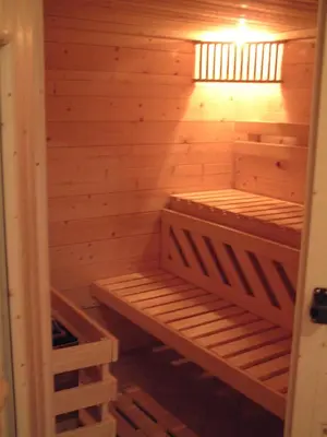 a wooden sauna with a light on top of it at Residence Hofer in Valdaora