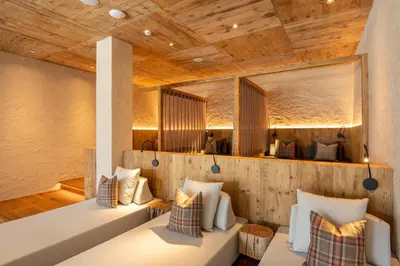 a room in a wooden house with two pillows at Residence Iris in Valdaora