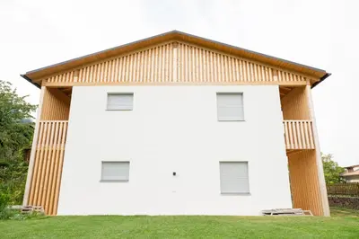 a white house with a brown roof at Lahnhof in Lana