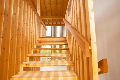 a staircase in a building with wooden walls at Lahnhof in Lana
