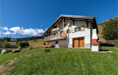 a house on a hill with a green field at Beautiful Home In Castello Tesino in Castello Tesino