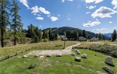 a field with rocks on a hill with a fence at Beautiful Home In Castello Tesino in Castello Tesino