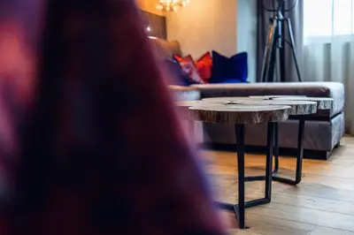 a coffee table in a living room with a couch at Loom in Bolzano