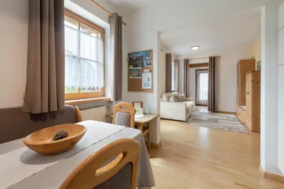 a living room with a table with a bowl on it at Nuierhof in Castelrotto