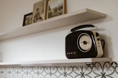 a radio sitting on a shelf in a room at Valentinhof - organic farm in Merano