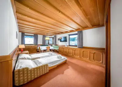 a large bedroom with a large bed in a room at Villa Pana in Santa Cristina in Val Gardena