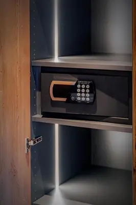 a microwave with a remote control inside of it at Villa Pana in Santa Cristina in Val Gardena