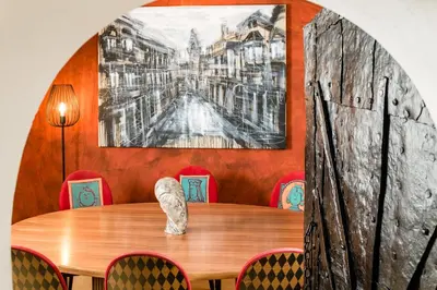 a dining room with a wooden table and chairs at Hotel Restaurant Lilie in Vipiteno