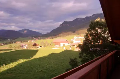 a view from a balcony of a village in the mountains at Residence Viktoria in Castelrotto