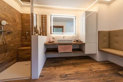a bathroom with a sink and a shower at Villa Vintila with Whirlpool & Sauna in Vandoies