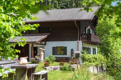a house with a porch and a balcony at Villa Vintila with Whirlpool & Sauna in Vandoies