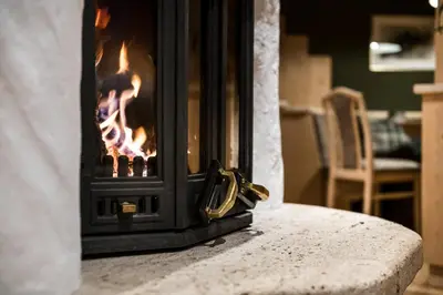 a fireplace sitting on top of a table at Ciasa Scjadu in San Cassiano