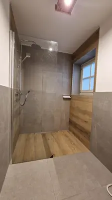 a bathroom with a shower with a glass door at Appartamento Col Val di Fassa con giardino BAGNI RINNOVATI 2023 in Campitello di Fassa